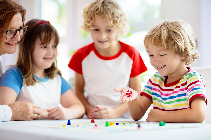 Family playing board game at home